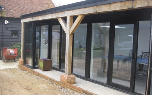 Outbuilding conversion within the curtilage of a Grade II listed building
