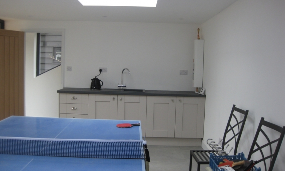 Outbuilding conversion within the curtilage of a Grade II listed building